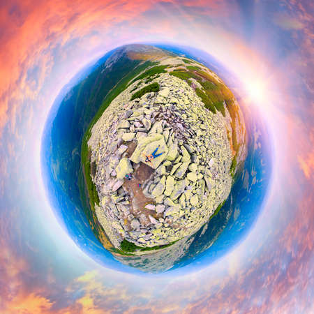 On the slopes of Mount Syvuli, Ukraine, autumn and among the alpine pine and gray stone leaves of blueberries, lingonberries, blueberries blush, trails for tourists and hunters. Aerial view drone copterの写真素材