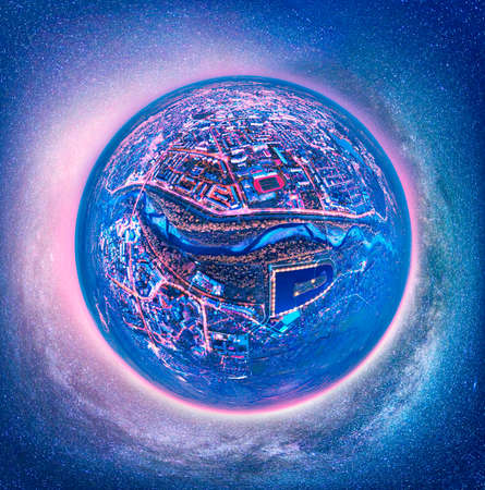 Spherical ball asteroid night panorama of the European city of Ivano-Frankivsk in Ukraine in the evening, lights and windows of houses, cars are shining. Aerial photography by a drone by a quadcopterの写真素材