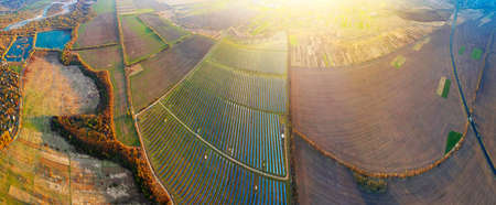 Solar panels in Ukraine, Eastern Europe. New technologies of "green energy" without thermal, chemical, and radiation contamination of the area are the future of civilization. Aerial photo with drone, quadrocopter.の写真素材