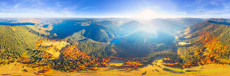 The famous Synevyr lake, a tourist attraction, in the Carpathians, Ukraine, autumn beech and coniferous forest, beautiful mountain landscape. Aerial view drone copterの写真素材