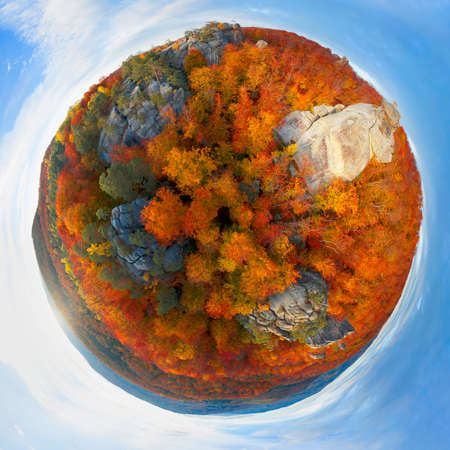 Aerial photo drone copter beautiful autumn beech forest and ancient rocks of Dovbush in Bubnishche Carpathians Ukraine, pagan temple and caves of a Christian monastery, tourist famous place. 360 Â° panoramaの写真素材