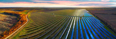 Solar panels in Ukraine, Eastern Europe. New technologies of "green energy" without thermal, chemical, and radiation contamination of the area are the future of civilization. Aerial photo with drone, quadrocopter.の写真素材