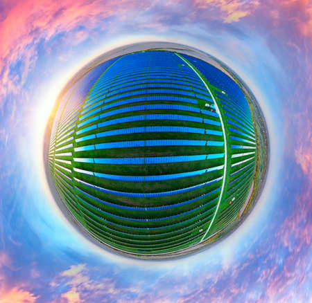 panorama of a field of solar panels providing clean green electricity to European enterprises,...