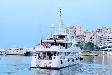 Luxury white boat comes to the marinaのeditorial素材