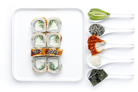 Sushi set on a white background. Sushi rolls in a white plate.の写真素材