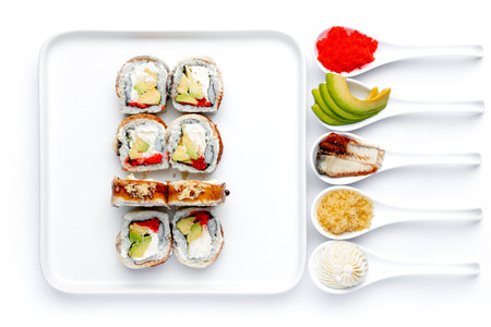 sushi set on a white background in a white porcelain spoonsの写真素材