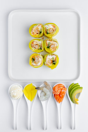 Sushi set on white background. Sushi rolls with salmon, shrimp, avocado, cream cheese and cream cheese. Top view.の写真素材