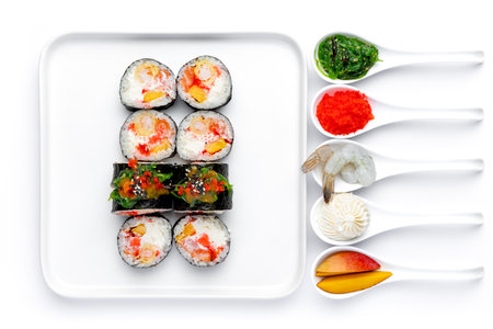 Sushi set on a white background. Sushi rolls in a white plate.の写真素材