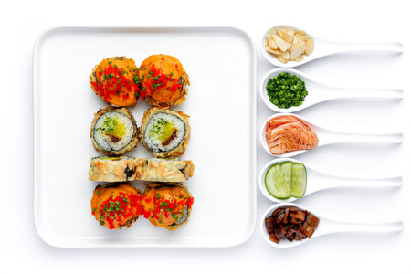 Sushi set in a white porcelain spoons on a white backgroundの写真素材