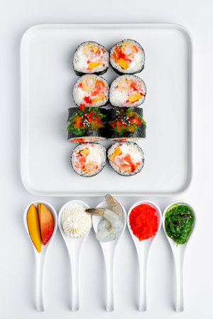 Sushi set on a white background. Sushi rolls on a white plate.の写真素材