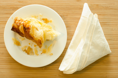 Crumb pie bread and napkin on wood tableの写真素材