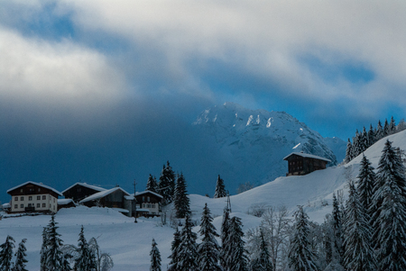 dark clouds in the european alps in winterの写真素材