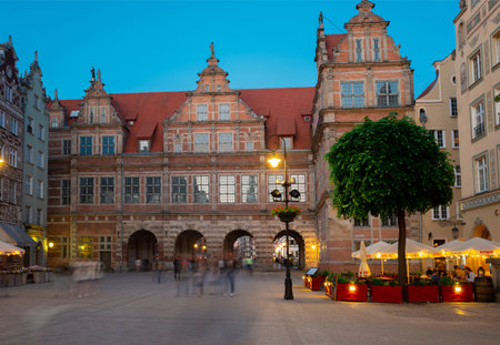 2022-06-08: Green gate at Dluga Street in the old city center at nightin. Gdansk, Poland