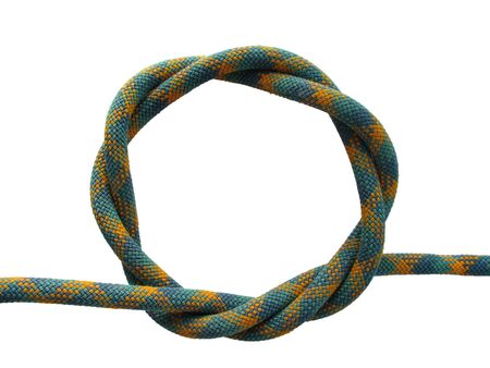twisted loop of green climbing rope isolated on whiteの写真素材