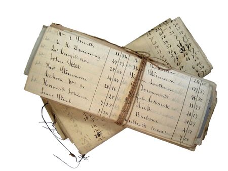 isolated 1900 account pages folded and tied with string isolated on whiteの写真素材