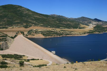 the earthfill Jordanelle dam blocks the Provo River to create Jordanelle Reservoir in Utahの写真素材