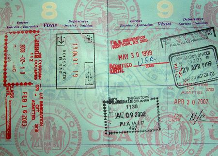 passport stamps from Europe and North America in a passportの写真素材