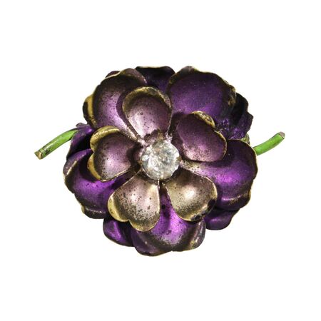 antique jewelry pin of a purple flower with gem in the center isolated on whiteの写真素材