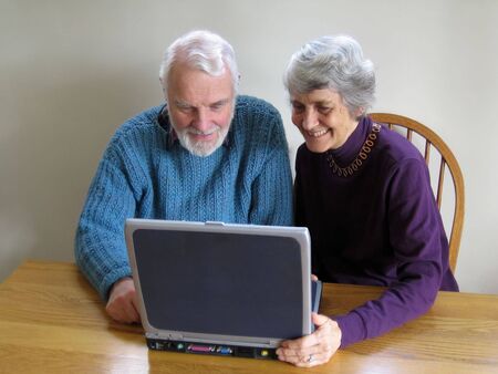 senior couple using laptop computerの写真素材