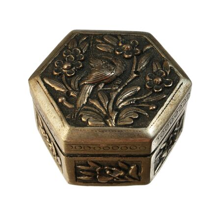 antique silver metal hexagonal box with floral and bird design isolated on whiteの写真素材