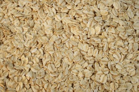 background of dry rolled oats or oatmealの写真素材