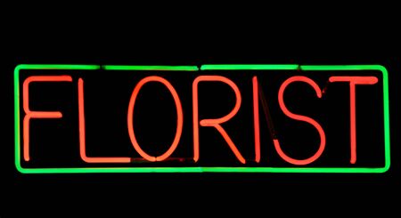 green and red electric neon florist signの写真素材