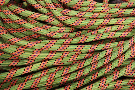 coiled up colored rock climbing rope backgroundの写真素材