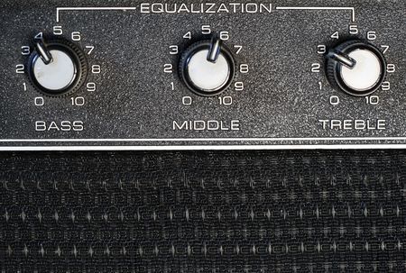 bass, middle, and treble equilization knobs on an amplifierの写真素材