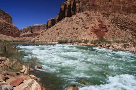 the Colorado River flows through Badger Creek rapid in Marble Canyon, Grand Canyon, Arizonaの写真素材