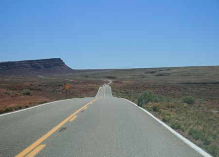 highway 89A in Northern Arizona cuts across the desert into heat hazeの写真素材