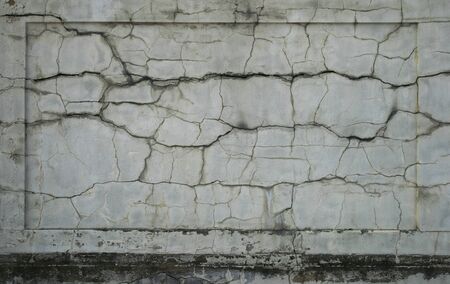 damaged plastered cracked wall panel for background textureの写真素材