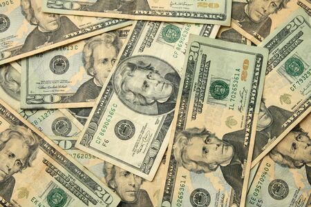 background of used old and new twenty dollar US billsの写真素材
