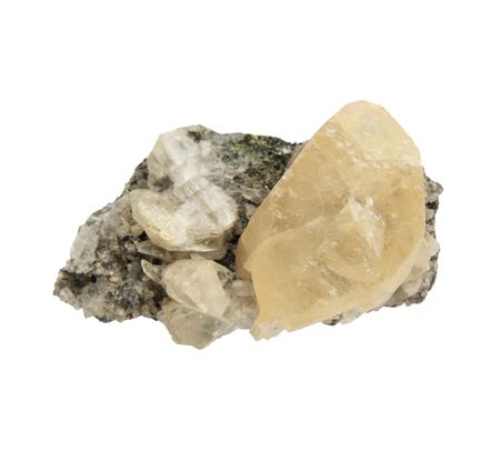 calcite crystals on a rock sample isolated on whiteの写真素材