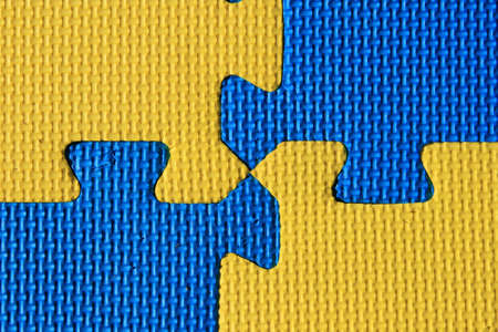 blue and yellow padded child play mat backgroundの写真素材