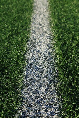 white line on an artificial turf athletic field
