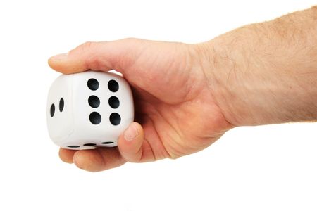 a man's hand rolling a giant white die isolated on whiteの写真素材