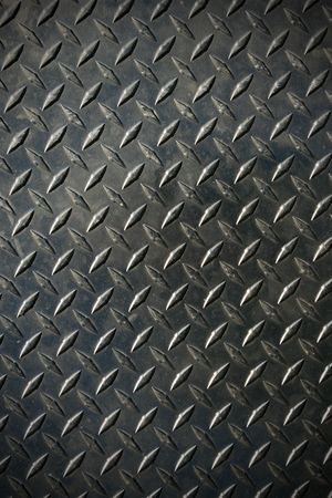 diamond tread steel background texture with slight vignetteの写真素材