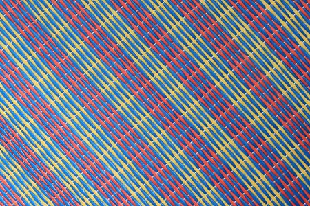 diagonal striped woven plastic beach mat backgroundの写真素材