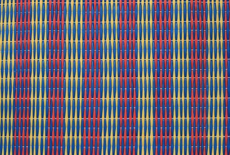 striped woven plastic beach mat detail background