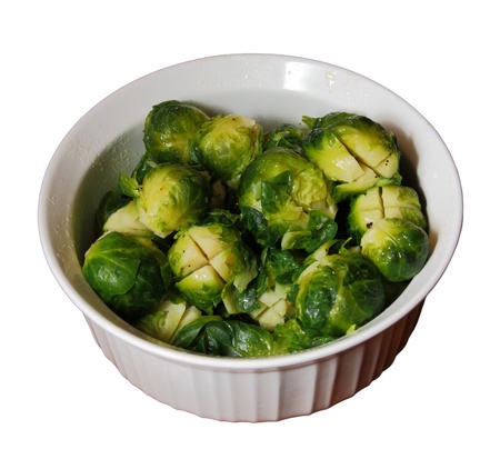 white bowl of cooked brussels sprouts isolated on whiteの写真素材
