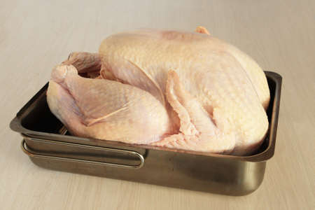 raw turkey in a pan ready for stuffing or bakingの写真素材