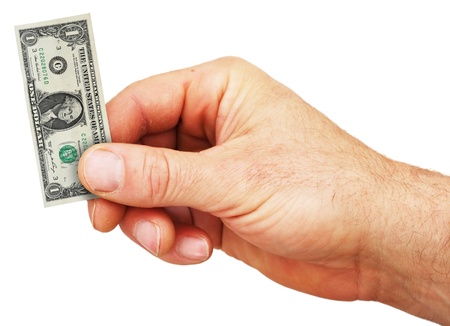 a hand holding a tiny US dollar billの写真素材