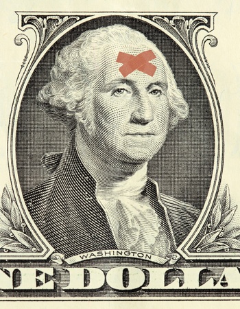 Washington portrait from US one dollar bill with bandages on his foreheadの写真素材