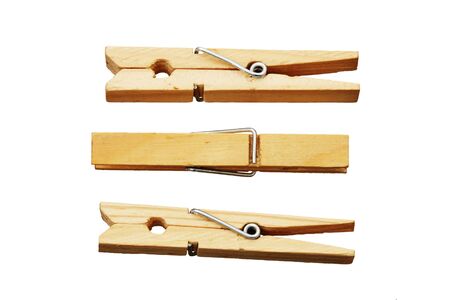 three clothes pins or pegs isolated on white backgroundの写真素材
