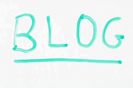 blog written on a whiteboard with a green markerの写真素材
