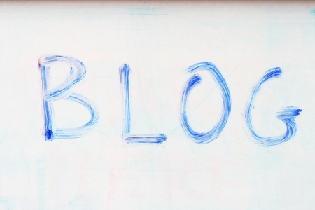 the word blog written on a whiteboard with an old blue markerの写真素材