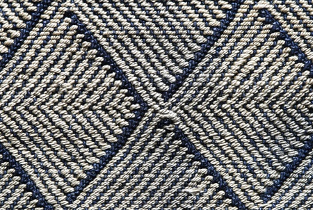 patterned cloth background with blue and gray chevron pattern