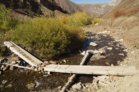 broken log bridge over McGee Creek in the Sierra Nevadaの写真素材