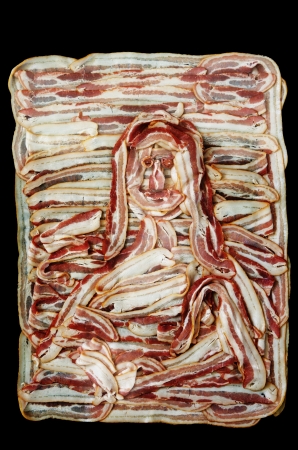 Bacon Lisa or a rendering of the mona lisa in raw bacon with black backgroundの写真素材