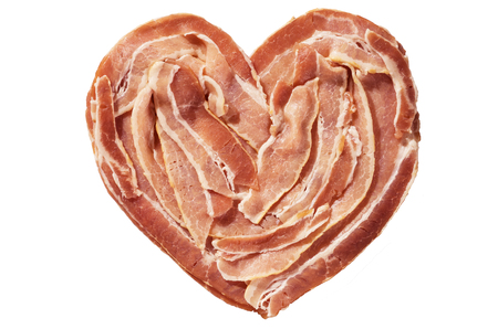 raw bacon heart isolated on a white backgroundの写真素材